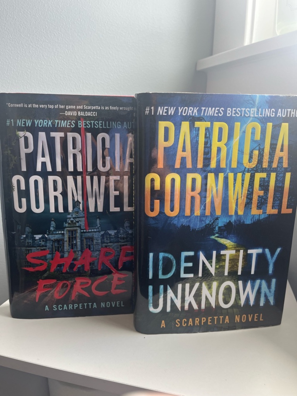 Patricia Cornwell’s IDENTITY UNKNOWN & SHARP FORCE hardcover novels.